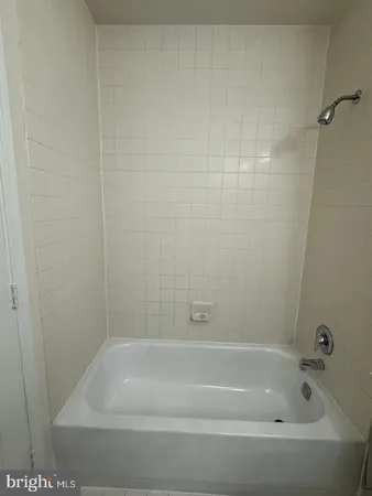 a bathroom with a toilet a sink and shower