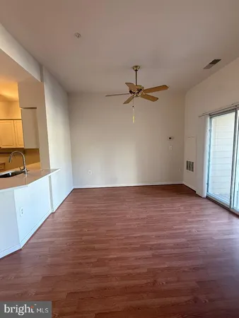 a kitchen with stainless steel appliances a refrigerator sink and cabinets