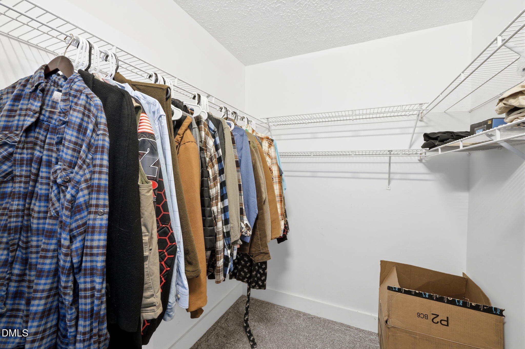 1925 Old Allensville Road Roxboro, NC 27574 - Photo 47 of 58 a view of walk in closet with clothes and shoes