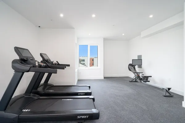 a view of room with gym equipment