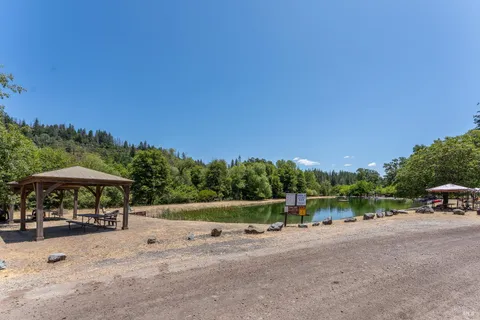 a view of a backyard with sitting area