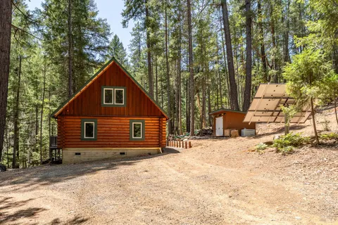 a house with trees in the background