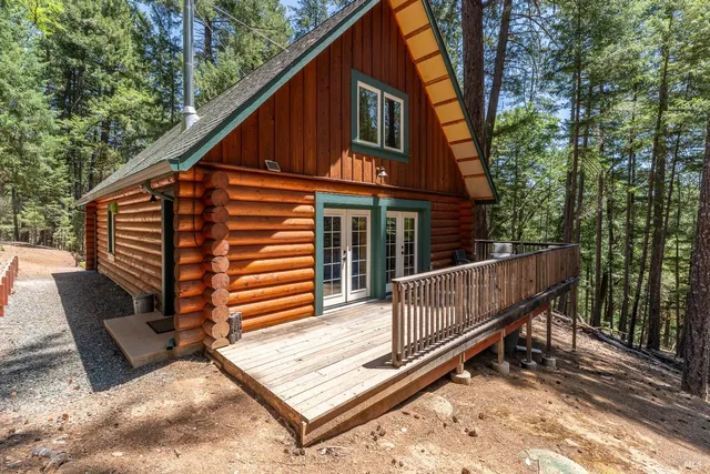 a view of a balcony with couches and wooden floor