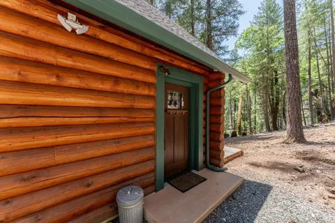 a view of house with backyard and sitting area