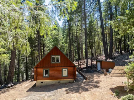 an aerial view of a house with a yard