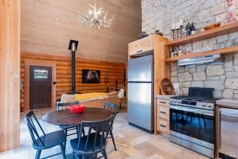 a dining room with furniture and window