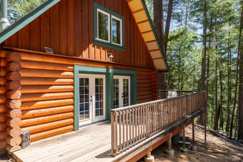 a view of a wooden fence and a yard