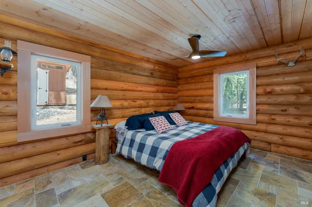 a bedroom with a bed a window and closet