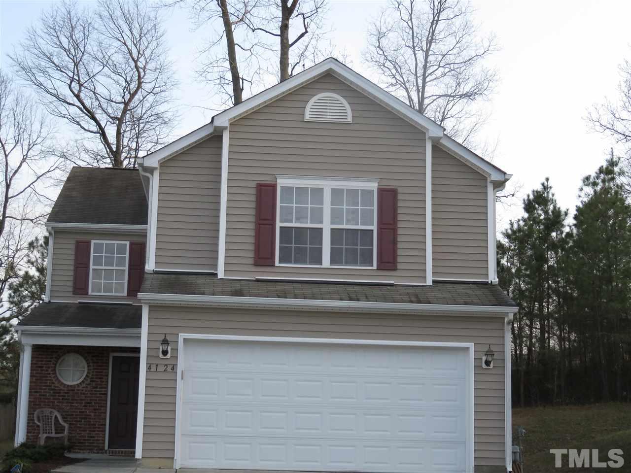 4124 Dalcross Road Raleigh, NC 27610 - Photo 1 of 14 a front view of a house with a yard
