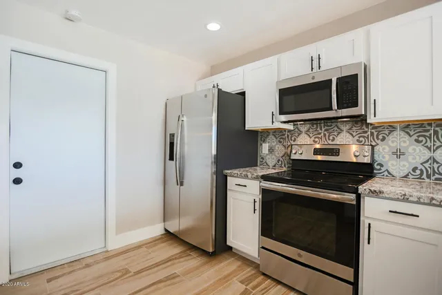 a kitchen with a stove and a microwave