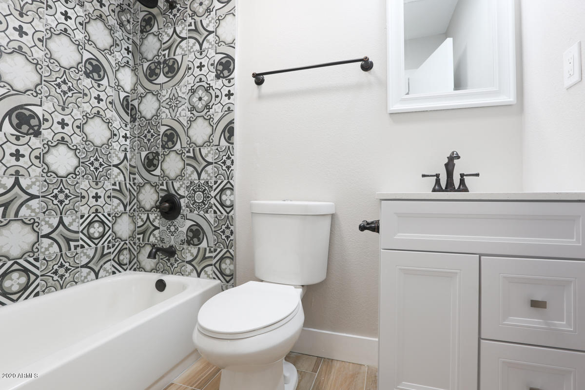1817 East Alameda Drive Tempe, AZ 85282 - Photo 15 of 31 a bathroom with a sink a toilet and bathtub