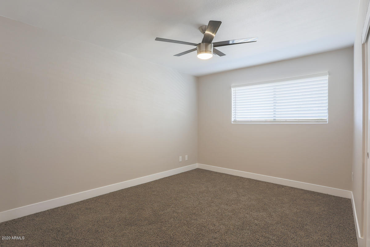 1817 East Alameda Drive Tempe, AZ 85282 - Photo 18 of 31 a view of a livingroom with a ceiling fan and window
