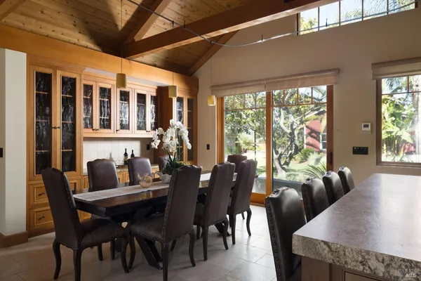a view of a dining room with furniture window and outside view
