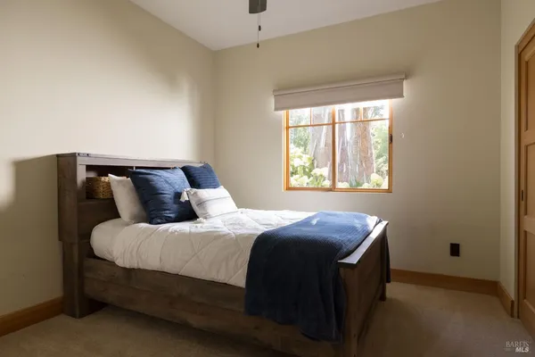 a bedroom with bed and window