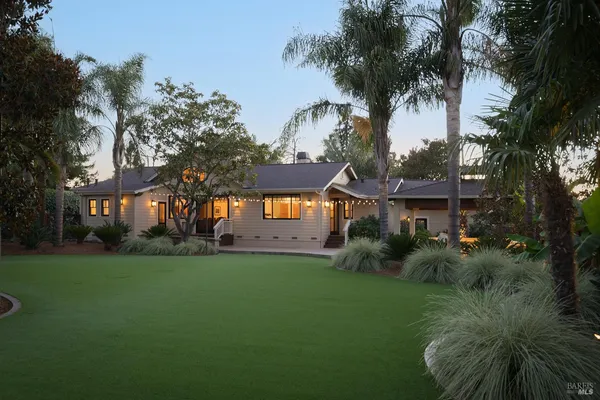 a view of a house with a yard
