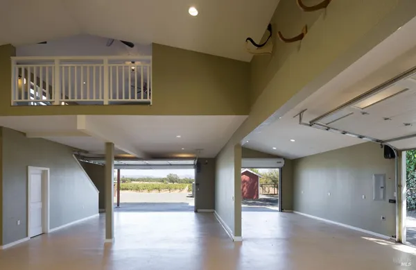 a view of livingroom with window ceiling fan and hardwood floor