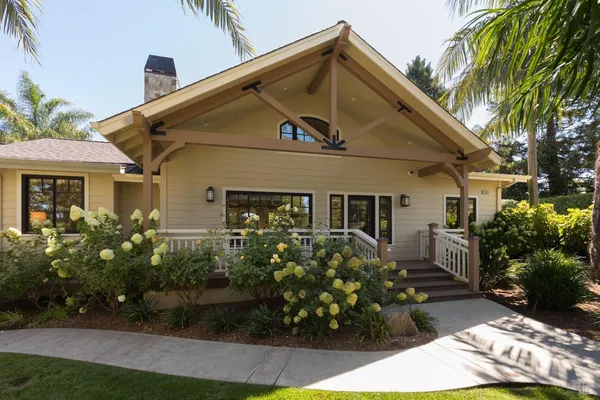 a front view of a house with garden