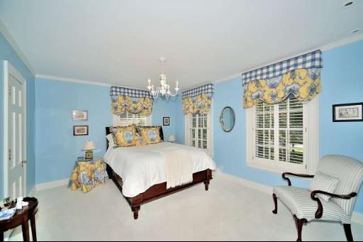 411 South County Line Road Hinsdale, IL 60521 - Photo 14 of 16 a bedroom with a bed a chair and a large window