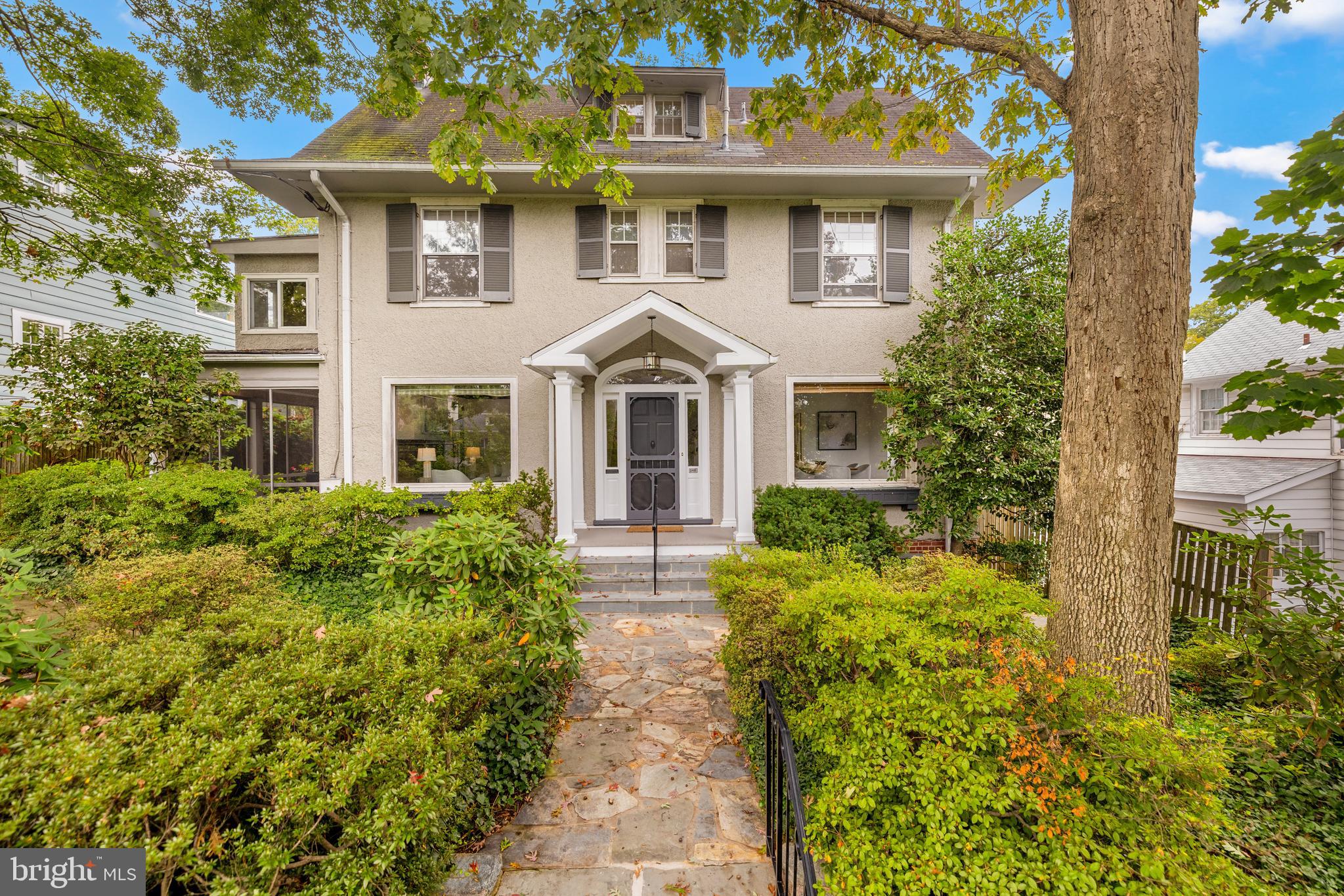 5410 39th Street Northwest Washington, DC 20015 - Photo 1 of 28 front view of a house with a yard