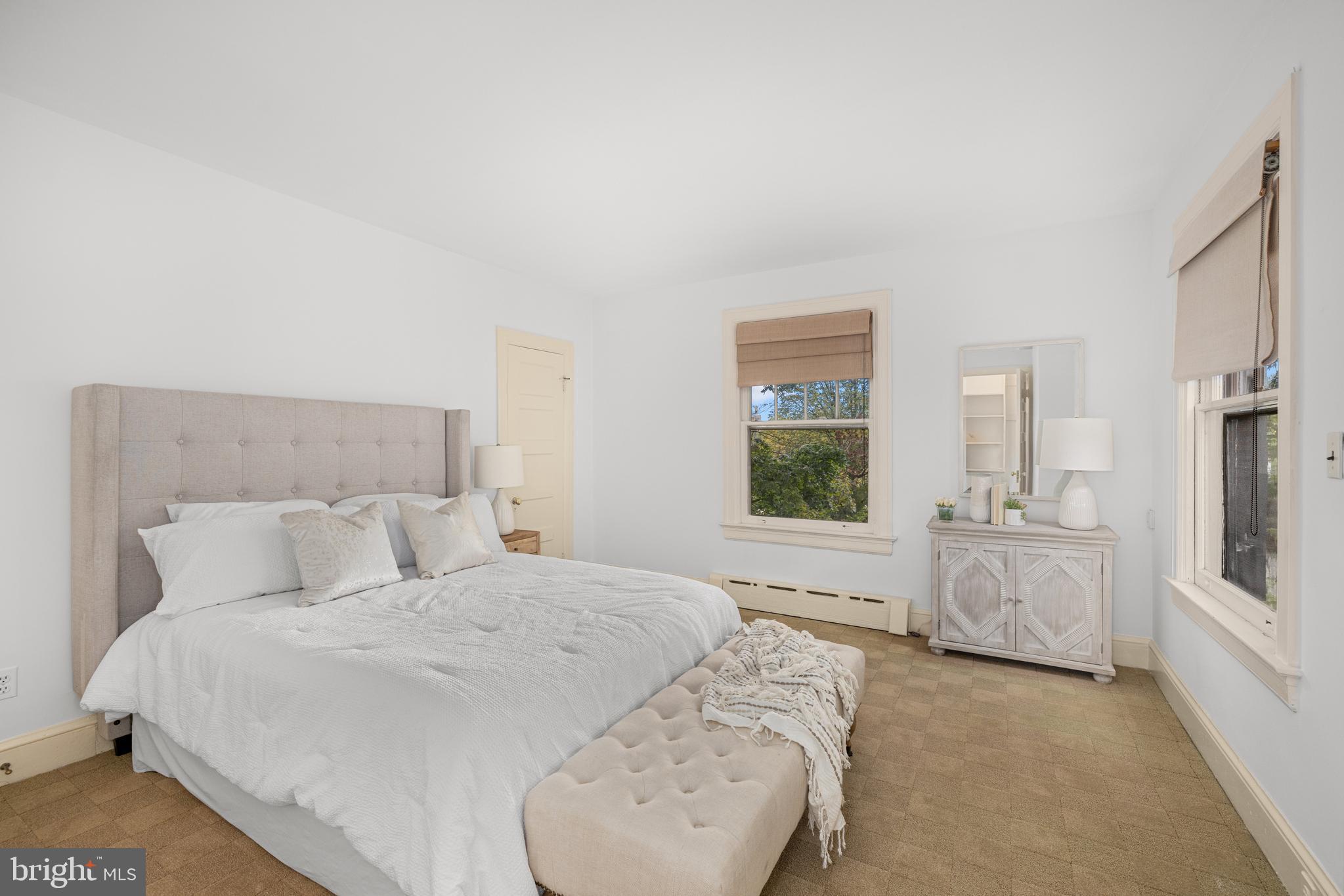 5410 39th Street Northwest Washington, DC 20015 - Photo 11 of 28 a bedroom with a bed and a couch