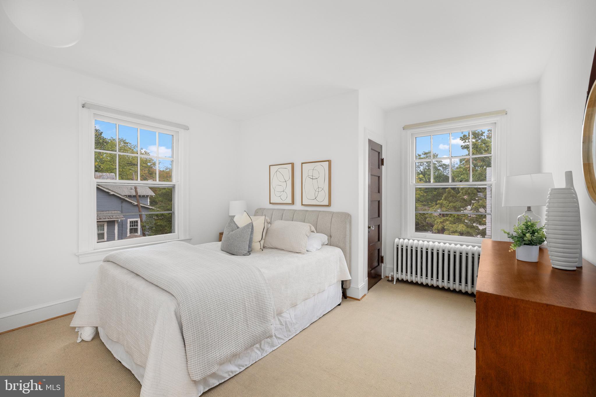 5410 39th Street Northwest Washington, DC 20015 - Photo 13 of 28 a bedroom with a bed and a table