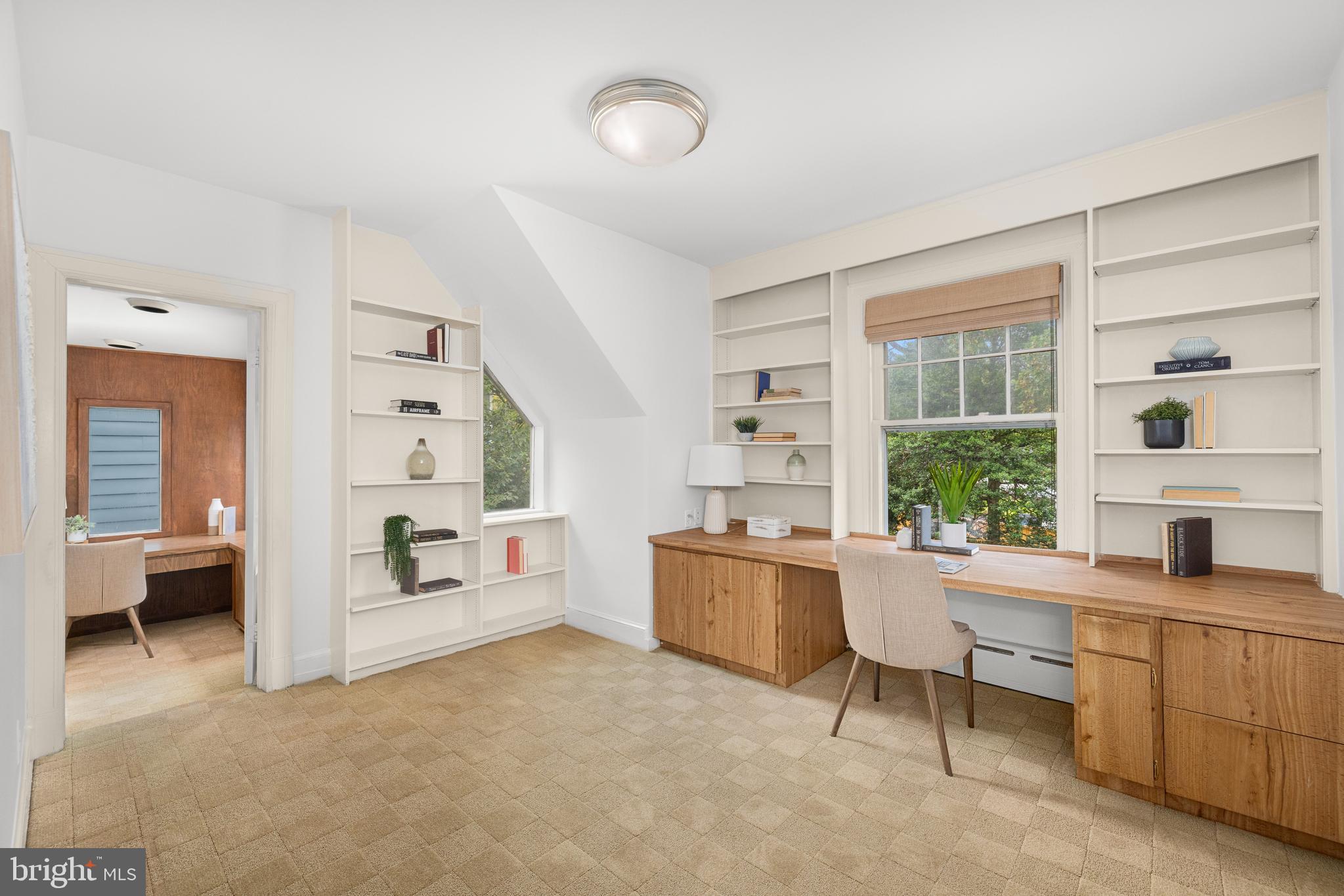 5410 39th Street Northwest Washington, DC 20015 - Photo 16 of 28 a room with furniture and a window