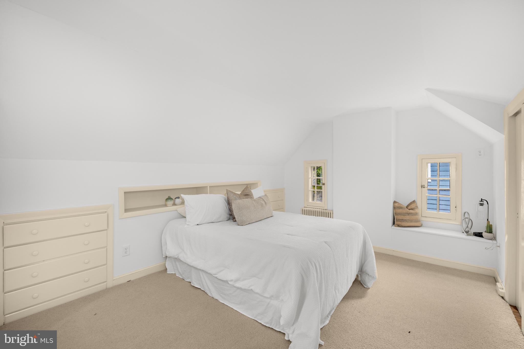 5410 39th Street Northwest Washington, DC 20015 - Photo 18 of 28 a bedroom with a bed and a night stand