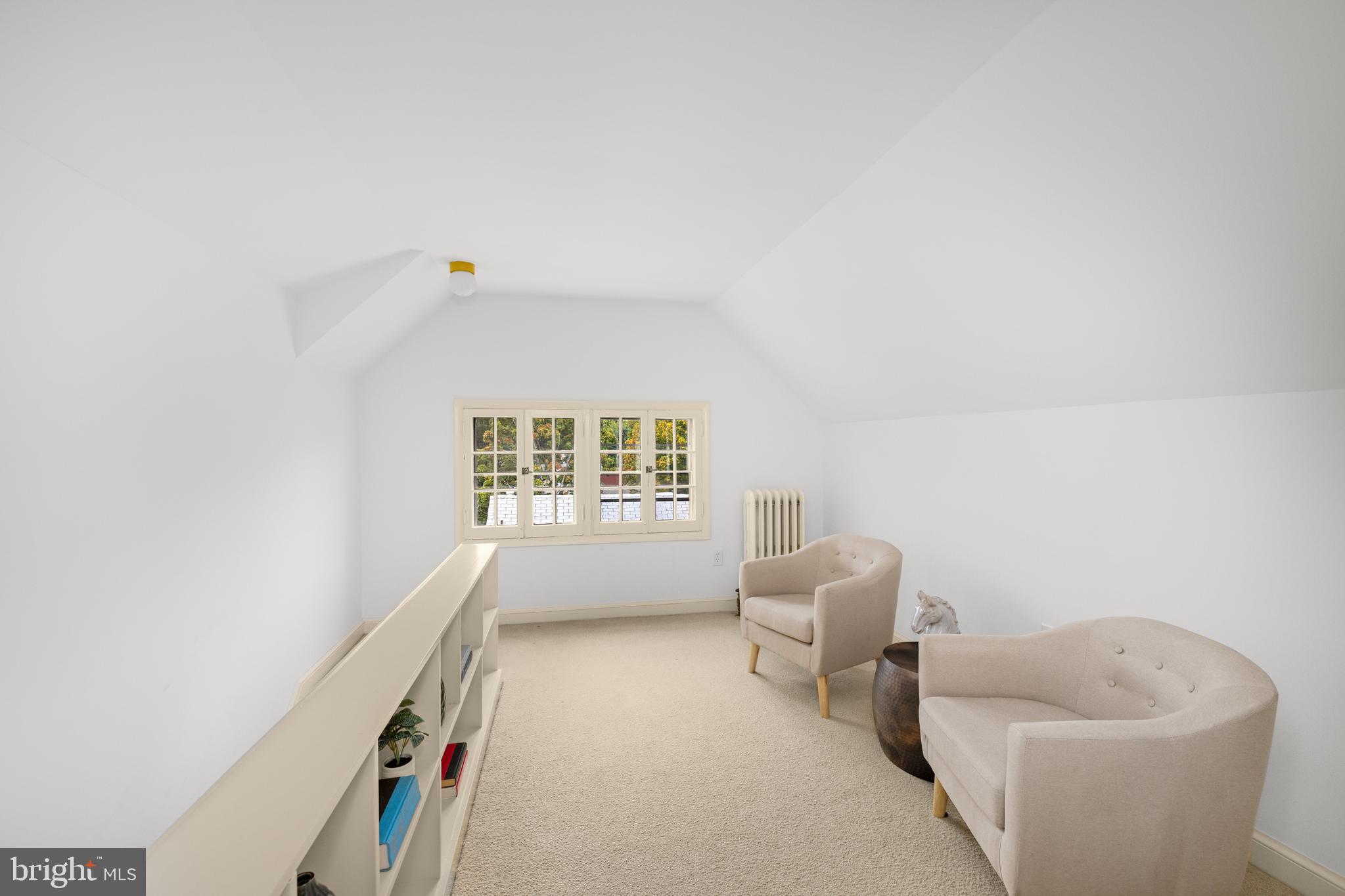 5410 39th Street Northwest Washington, DC 20015 - Photo 20 of 28 a living room with furniture and a window