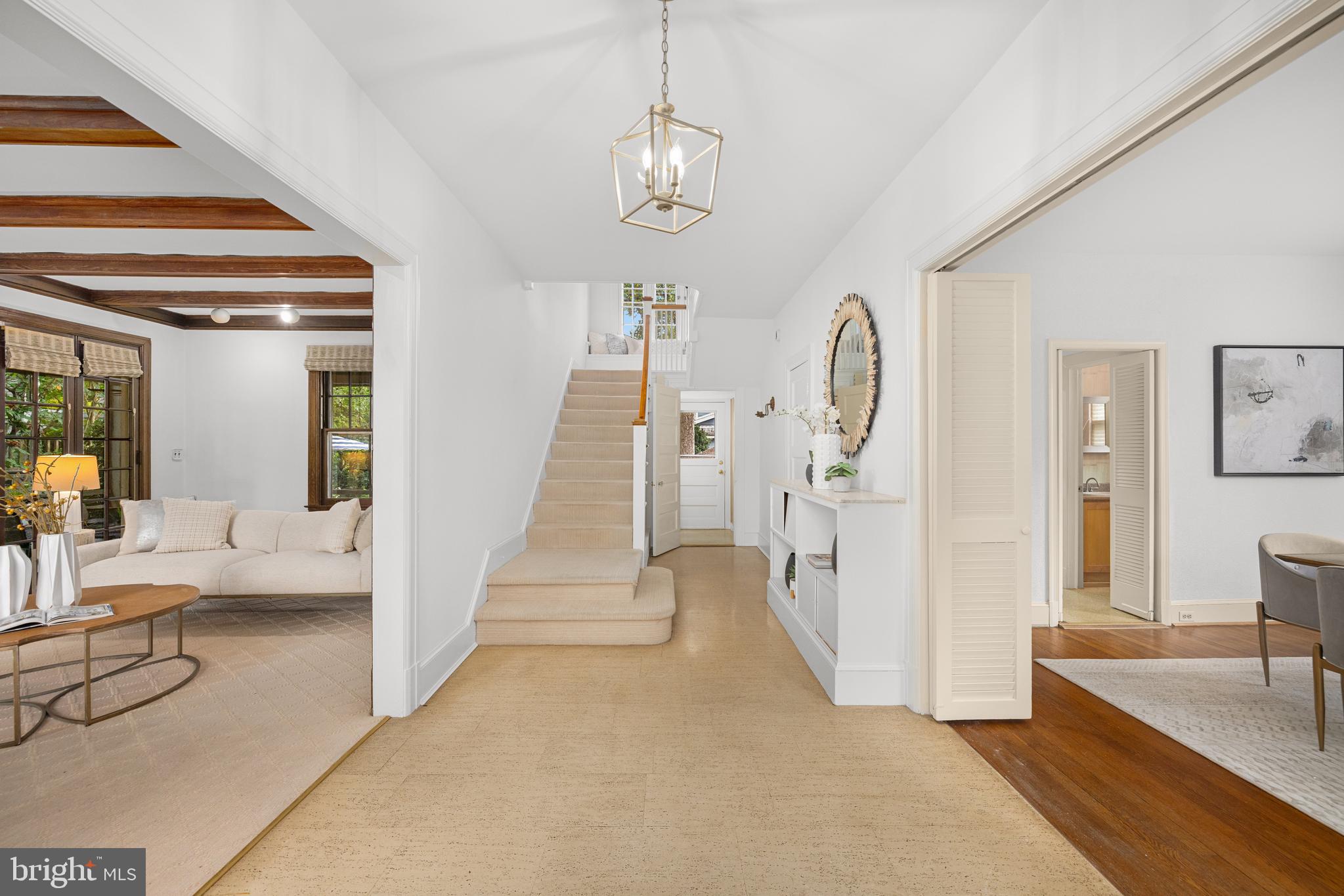 5410 39th Street Northwest Washington, DC 20015 - Photo 2 of 28 a very nice looking room with a large mirror and furniture