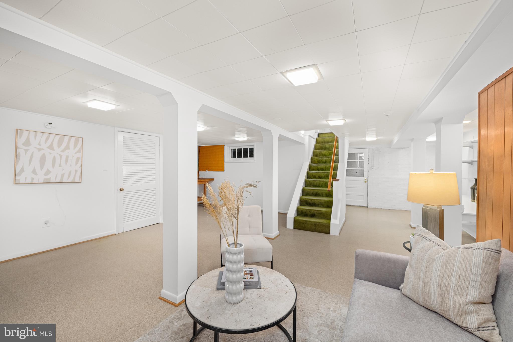 5410 39th Street Northwest Washington, DC 20015 - Photo 21 of 28 a living room with furniture and a wooden floor