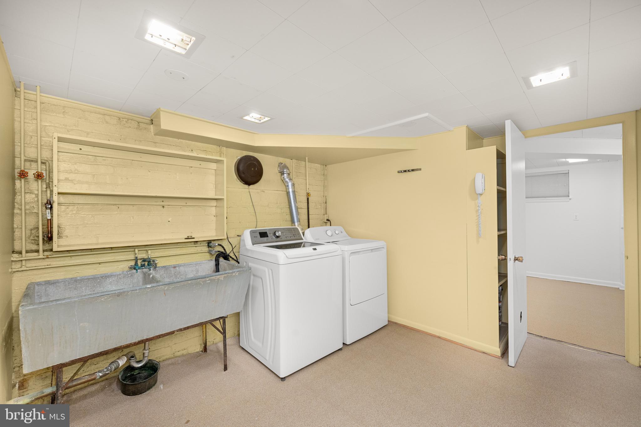5410 39th Street Northwest Washington, DC 20015 - Photo 23 of 28 a bathroom with a sink a mirror and a shower