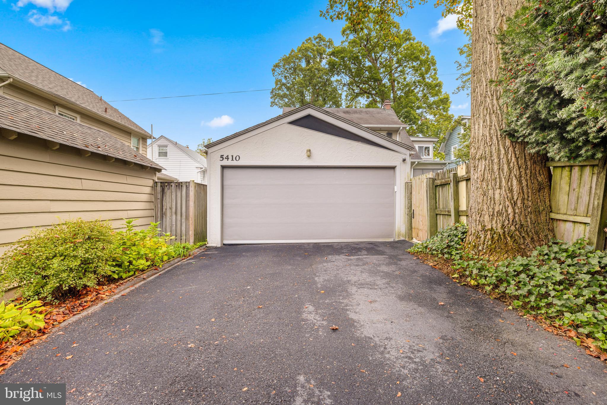 5410 39th Street Northwest Washington, DC 20015 - Photo 25 of 28 a view of a house with a yard and garage