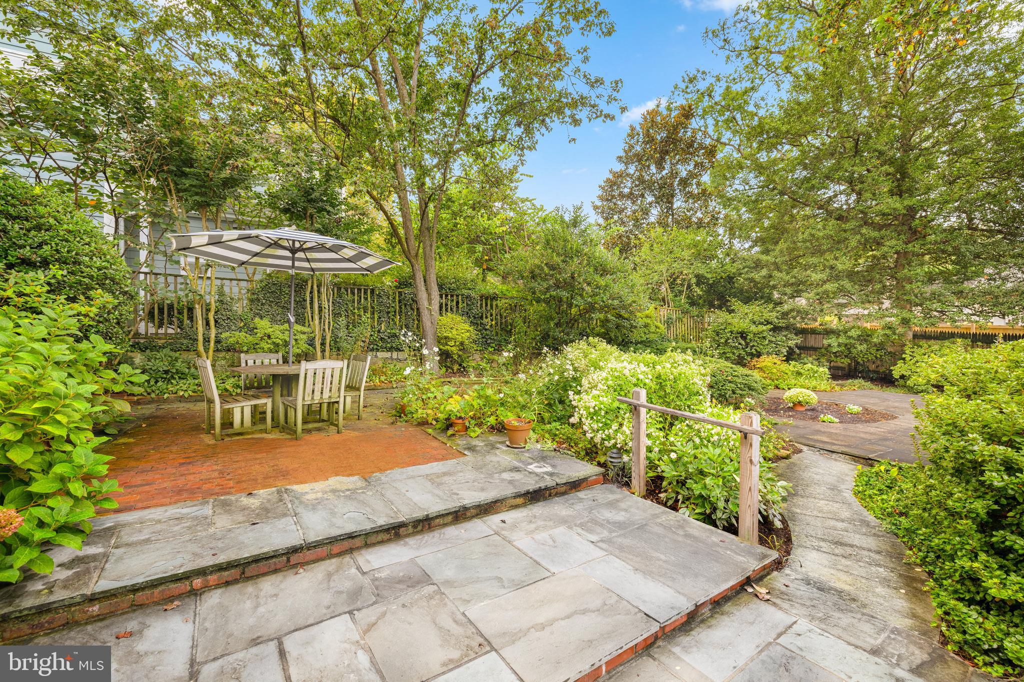 5410 39th Street Northwest Washington, DC 20015 - Photo 26 of 28 a view of a patio with table and chairs and potted plants