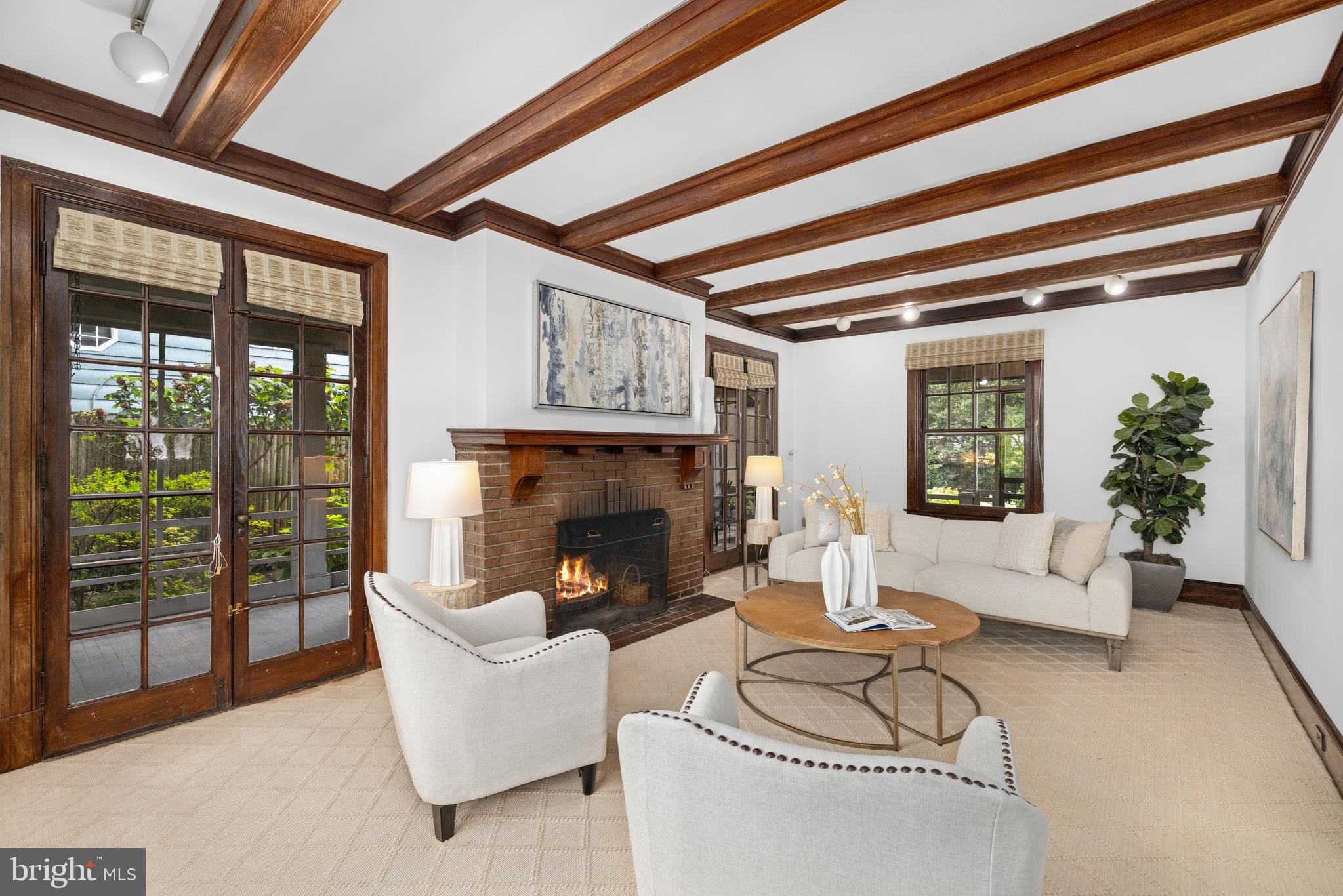 5410 39th Street Northwest Washington, DC 20015 - Photo 3 of 28 a living room with furniture and a fireplace