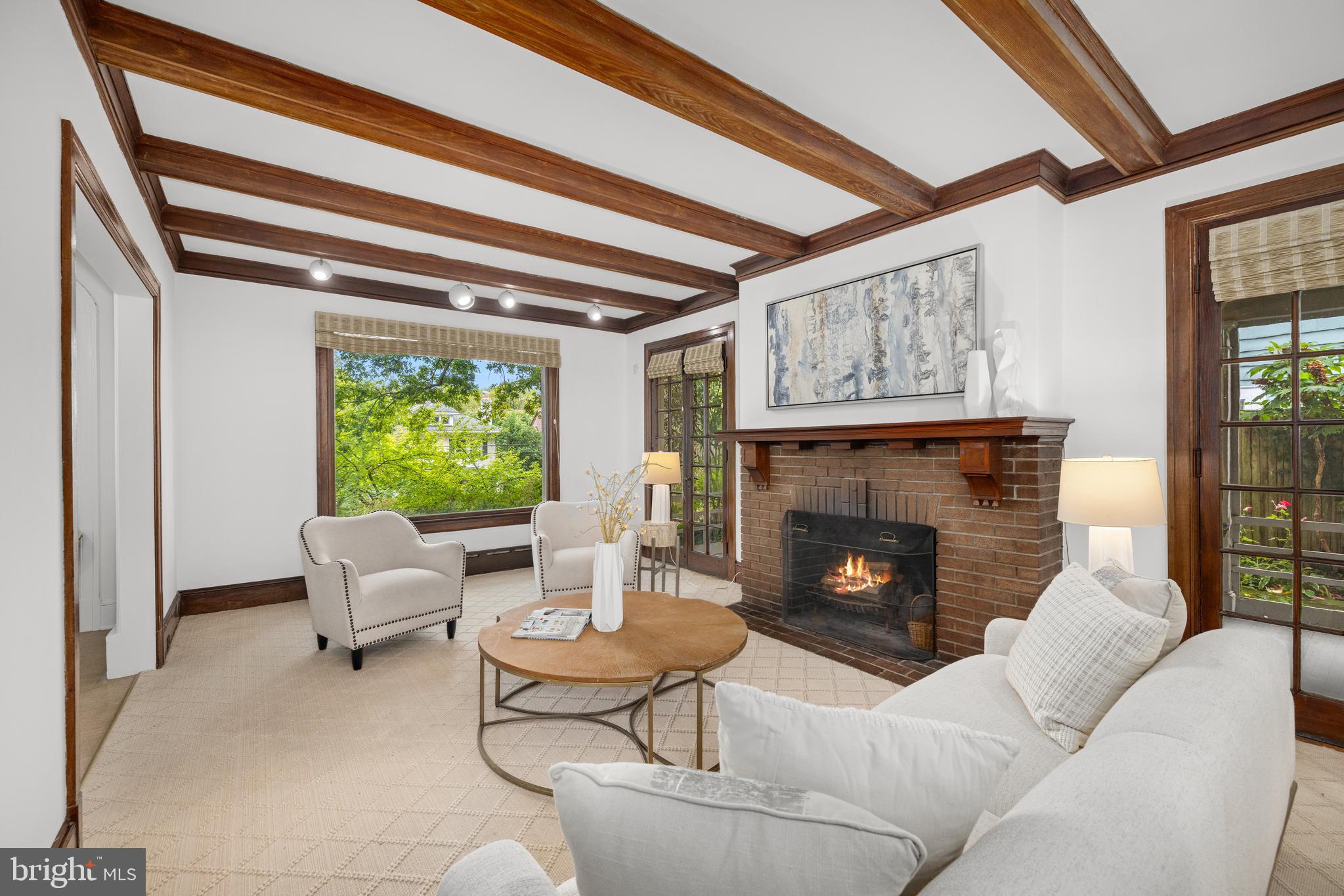 5410 39th Street Northwest Washington, DC 20015 - Photo 4 of 28 a living room with furniture and a fireplace