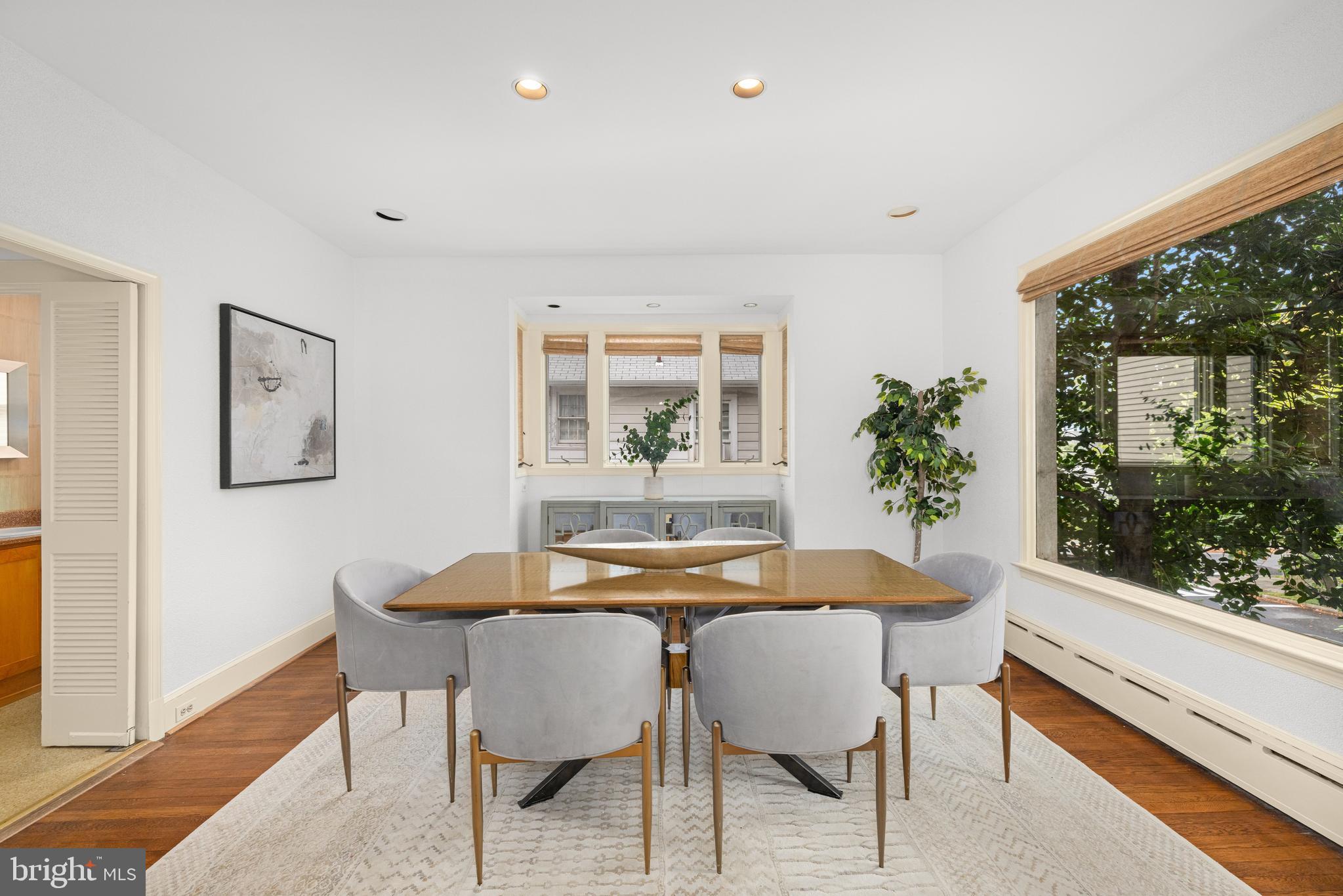 5410 39th Street Northwest Washington, DC 20015 - Photo 5 of 28 a dining room with furniture window and wooden floor