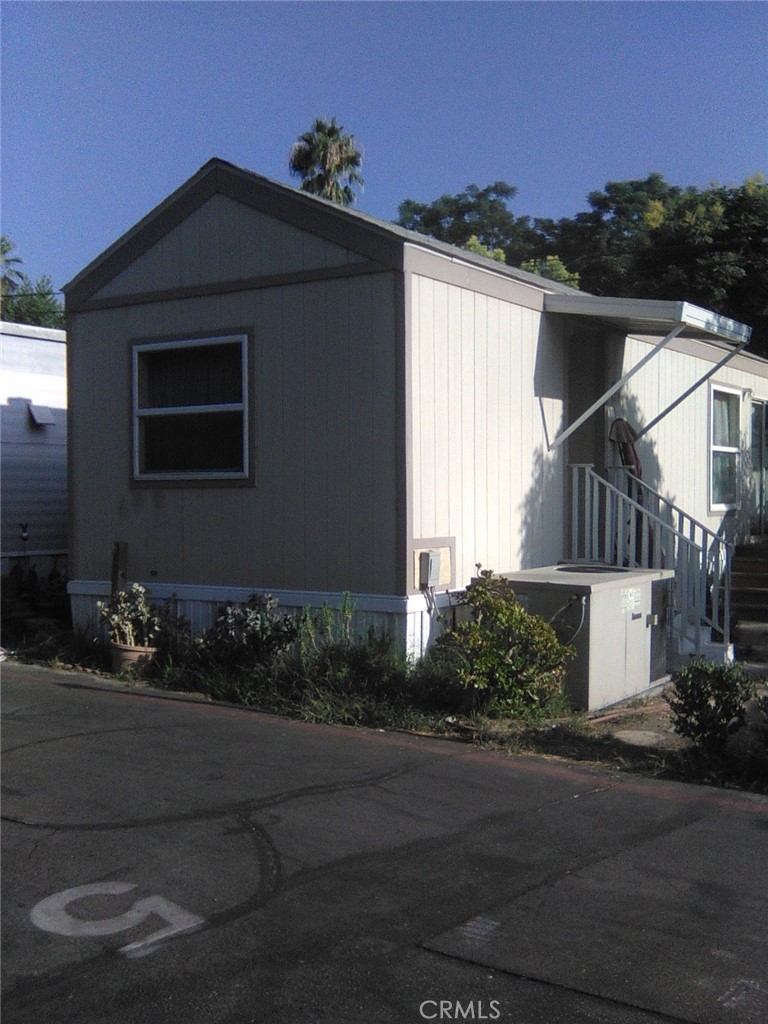 10799 Sherman Grove Avenue, Unit 18 Sunland, CA 91040 - Photo 2 of 7 a front view of a house
