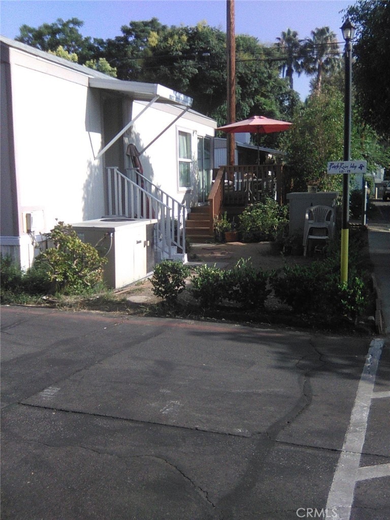 10799 Sherman Grove Avenue, Unit 18 Sunland, CA 91040 - Photo 3 of 7 a view of a house with a yard
