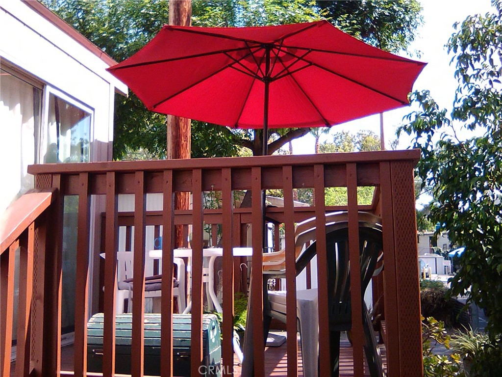 10799 Sherman Grove Avenue, Unit 18 Sunland, CA 91040 - Photo 6 of 7 a view of a patio with furniture and wooden deck