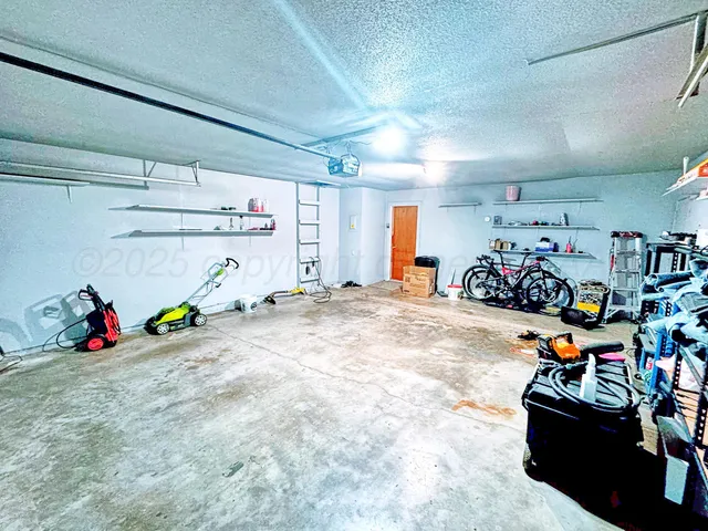 a view of a garage with a bike and car