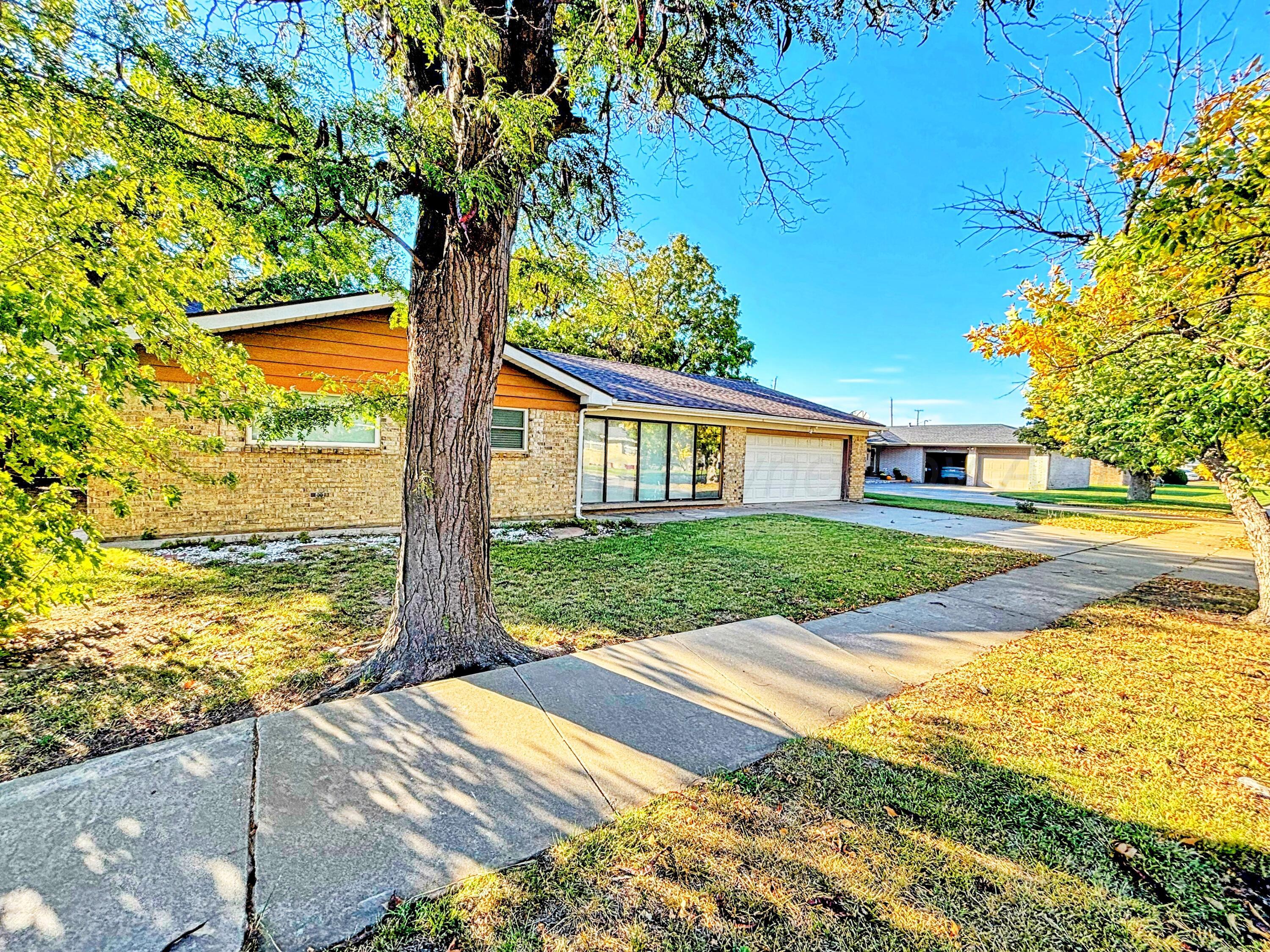 3210 South Ash Street Perryton, TX 79070 - Photo 2 of 28 a view of house with yard