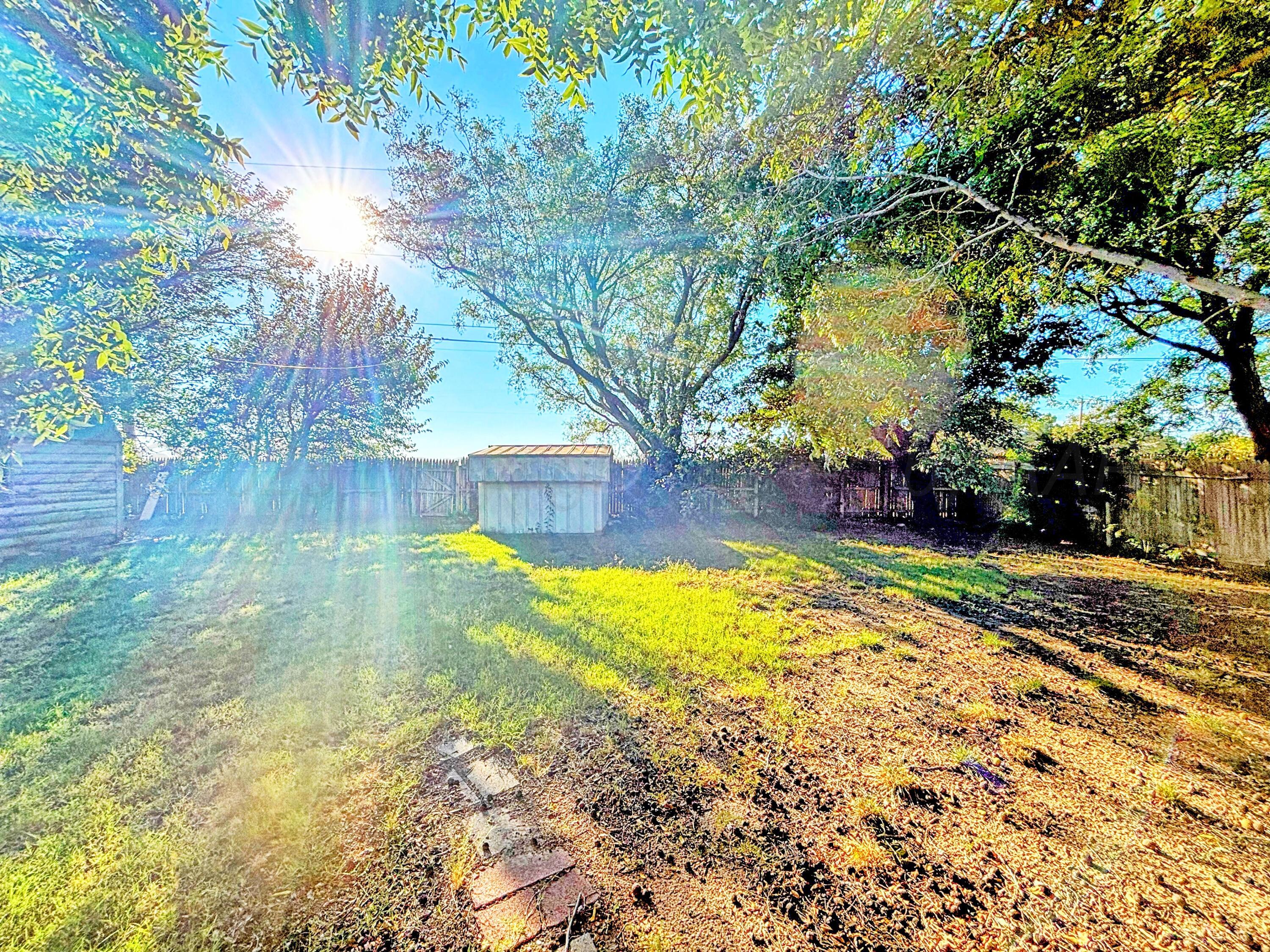 3210 South Ash Street Perryton, TX 79070 - Photo 23 of 28 a view of yard with swimming pool