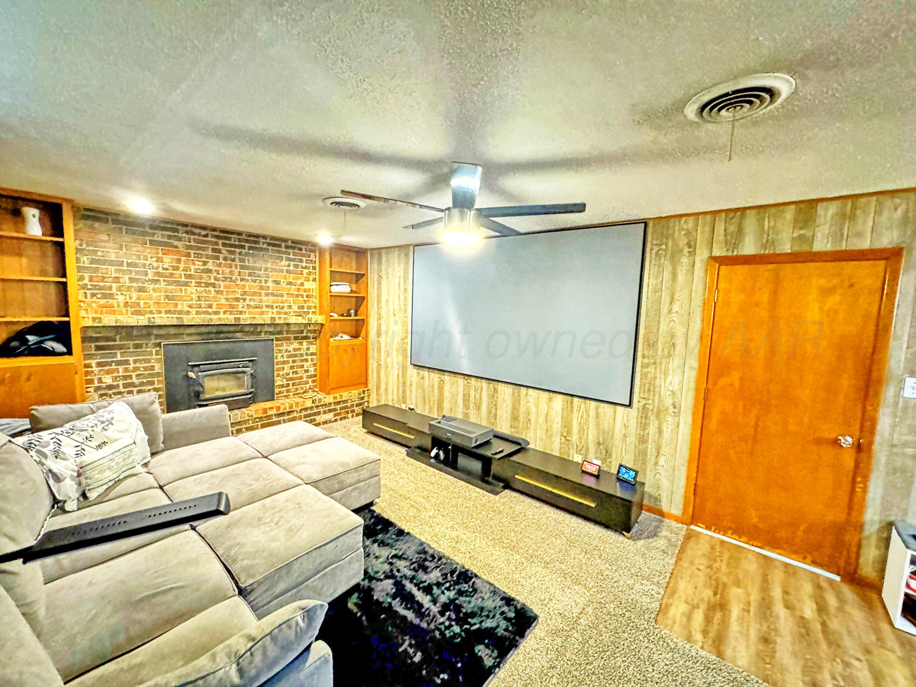 3210 South Ash Street Perryton, TX 79070 - Photo 5 of 28 a bedroom with a bed and wooden floor