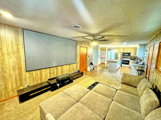 a living room with a couch and painted walls