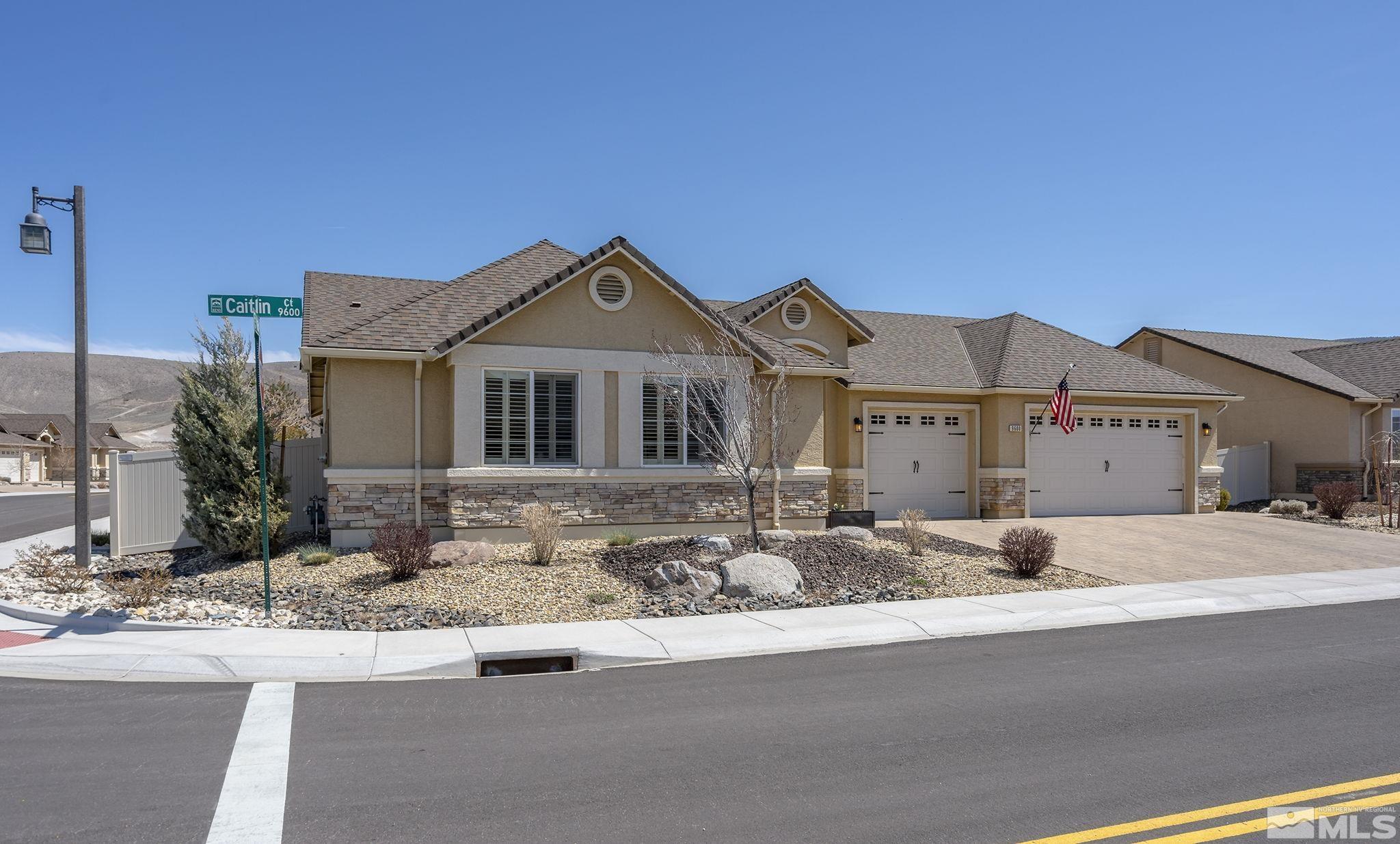 9600 Caitlin Court Reno, NV 89521 - Photo 1 of 35 a front view of a house with a yard