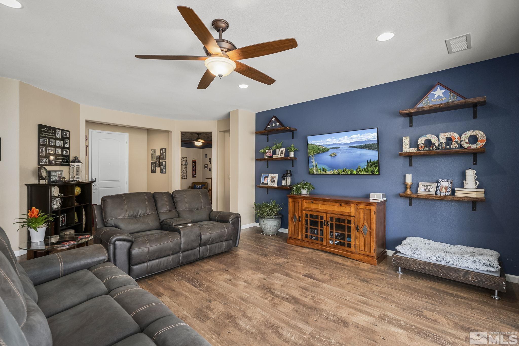 9600 Caitlin Court Reno, NV 89521 - Photo 6 of 35 a living room with furniture and a flat screen tv