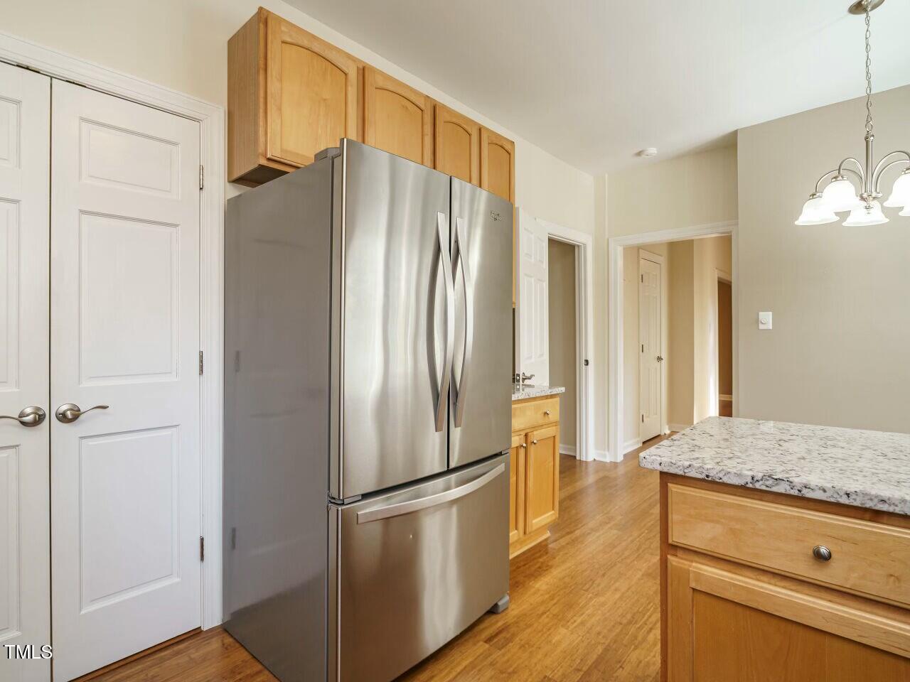 5917 Sentinel Drive Raleigh, NC 27609 - Photo 17 of 32 a kitchen with stainless steel appliances granite countertop a refrigerator and a granite counter tops