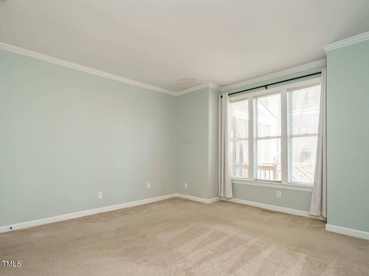 5917 Sentinel Drive Raleigh, NC 27609 - Photo 20 of 32 an empty room with a window