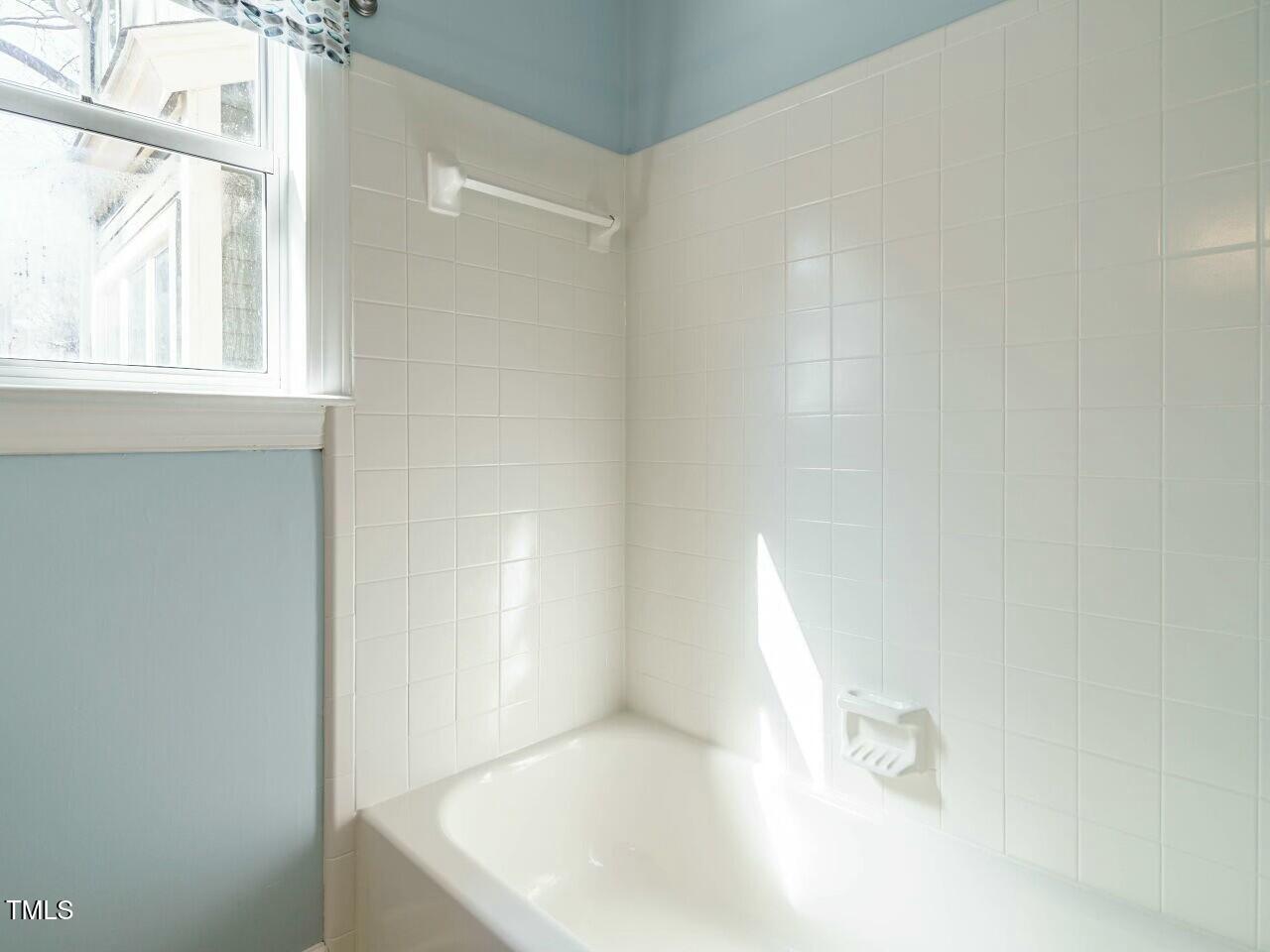 5917 Sentinel Drive Raleigh, NC 27609 - Photo 26 of 32 a bathroom with a bathtub
