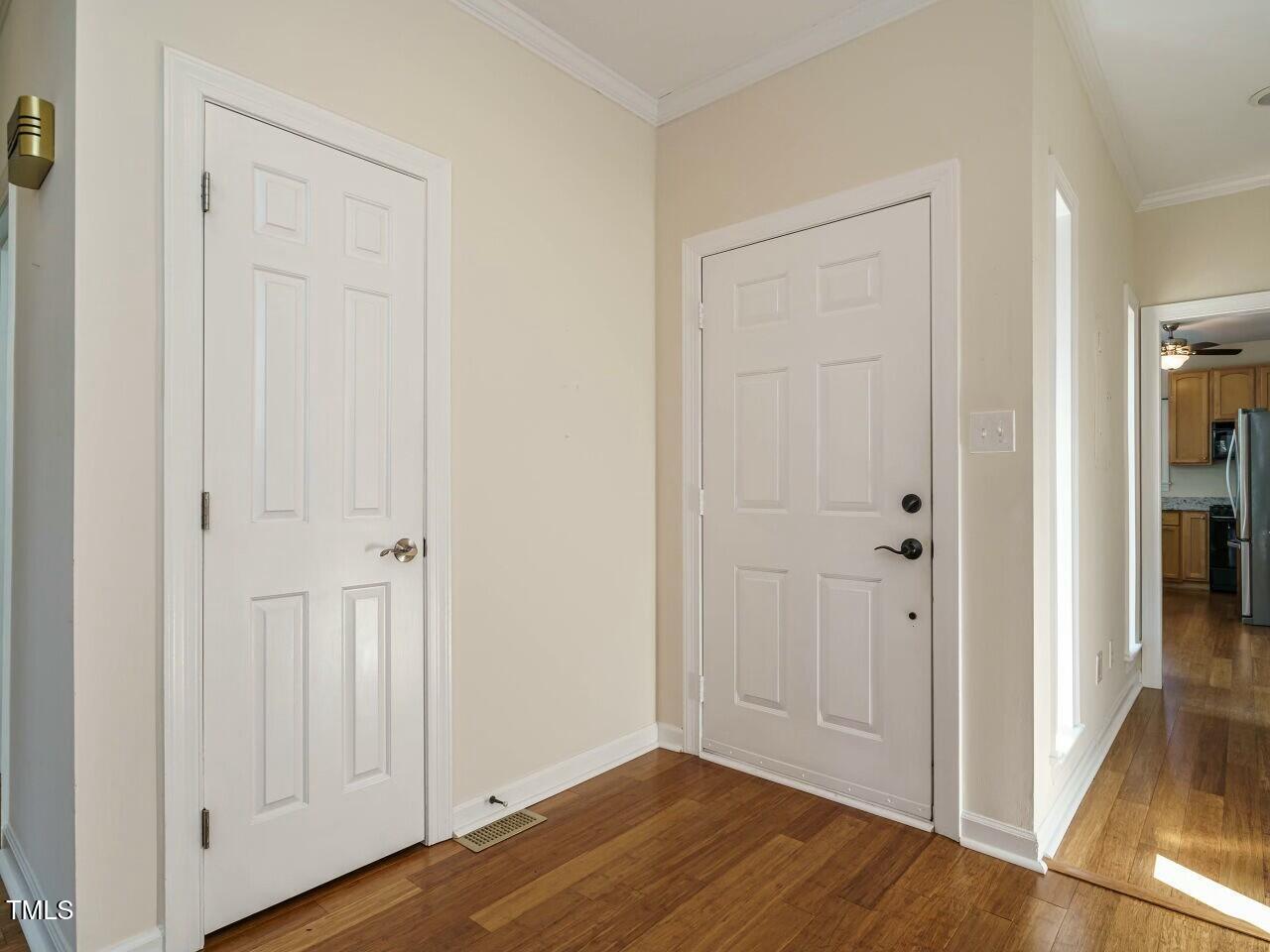 5917 Sentinel Drive Raleigh, NC 27609 - Photo 6 of 32 a view of an empty room with wooden floor